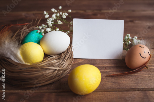 Easter eggs  on rustic wooden  background . Easter greeting card