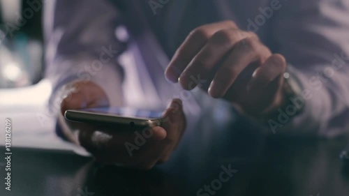 closeup of busines man hand using smartphone
