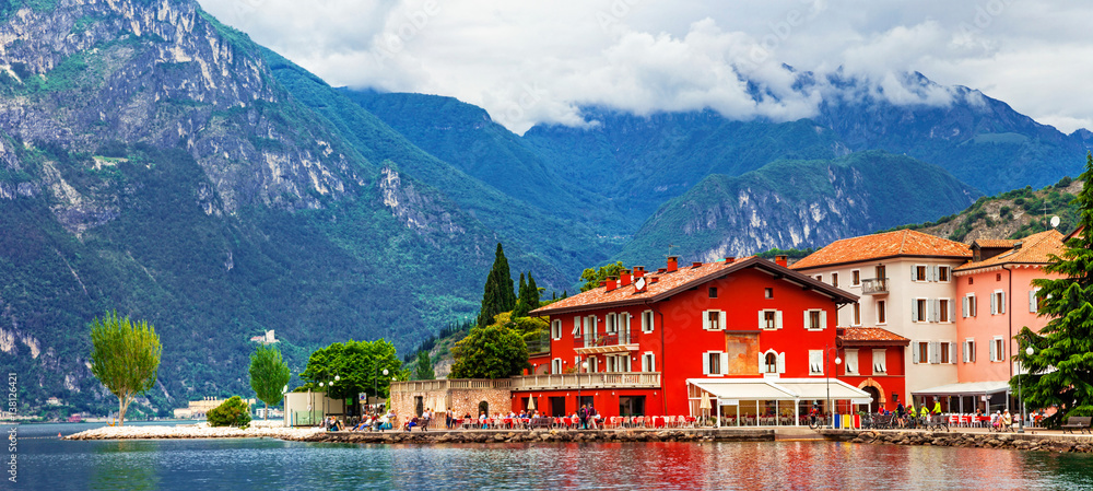 Alpine scenery - beautiful lake Lago di Garda and village Torbole. Italy