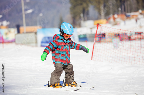 Little boy skiing downhill