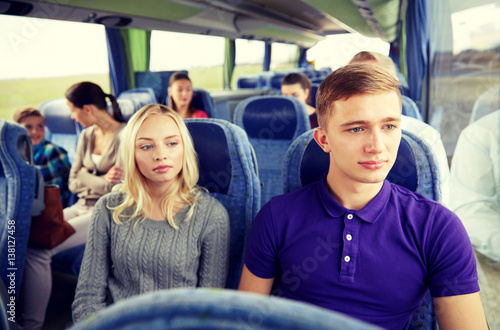 couple or passengers in travel bus © Syda Productions