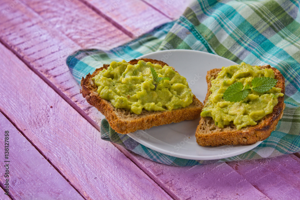 sandwiches with avocado paste on checked table cloth sandwiches with avocado paste on checked table cloth