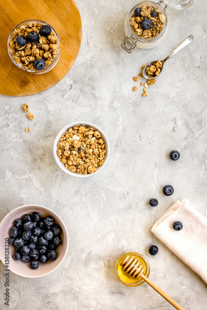 Oat flakes and berries granola glass on table background top view Oat flakes and berries granola glass on table background top view