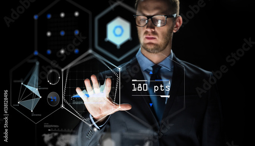 businessman touching virtual screen projection