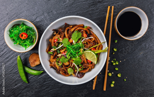 Asian noodles with spicy soy sauce and chicken photo