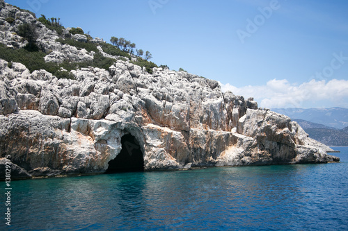 Sea cave in bay of Uchagiz in Mediterranean turkey photo