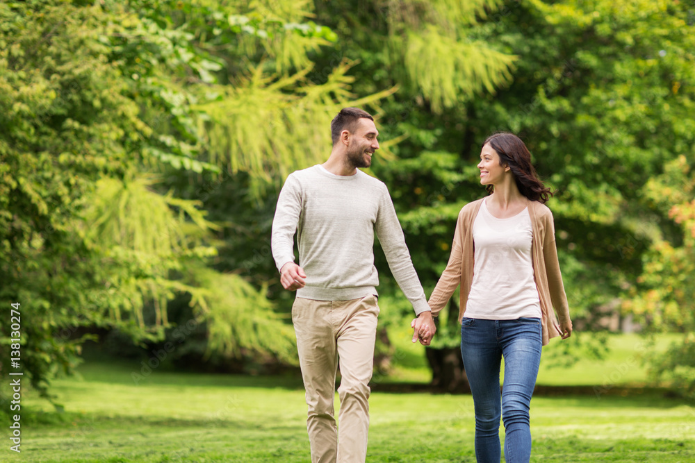 happy couple walking in summer park happy couple walking in summer park
