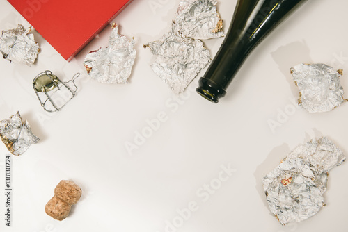 Slika na platnu the end of the holiday (an empty bottle of champagne and candy wrappers from can