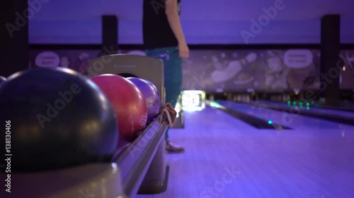 	Woman Throws Bowling Ball