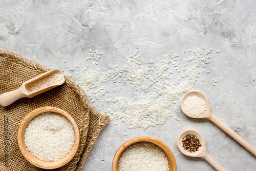 rice for paella on stone background top view mock up