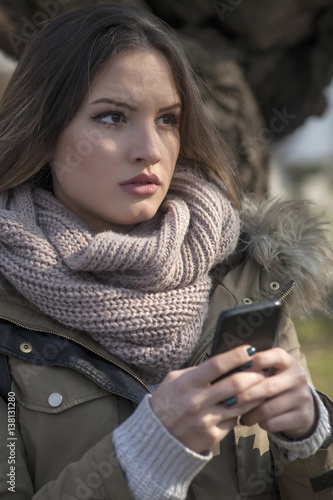 Young woman with a cell phone photo