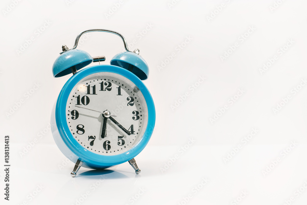 blue alarm clock on white background (in the morning and Wake up at work) blue alarm clock on white background (in the morning and Wake up at work)