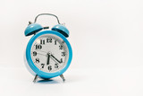 blue alarm clock on white background (in the morning and Wake up at work)
