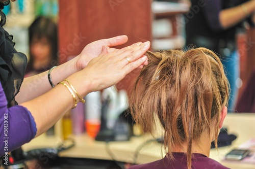 Hairdresser applying hair gel