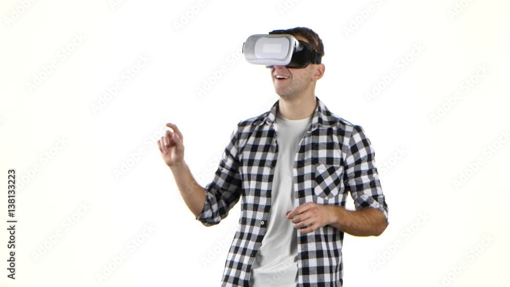 Man works with files in virtual reality glasses. White background Man works with files in virtual reality glasses. White background