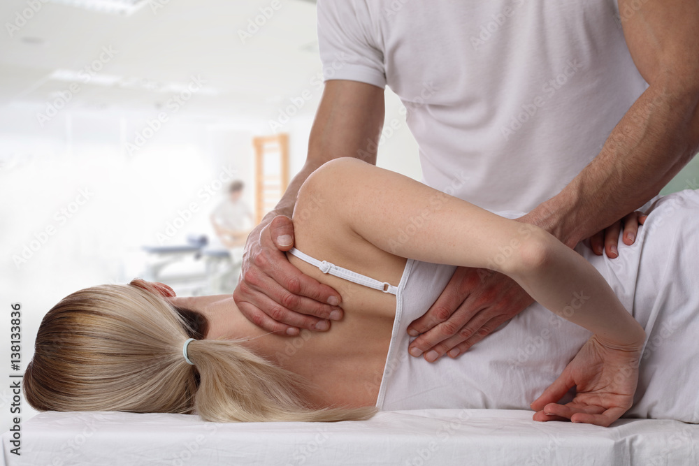 Fotografie Woman having chiropractic back adjustment