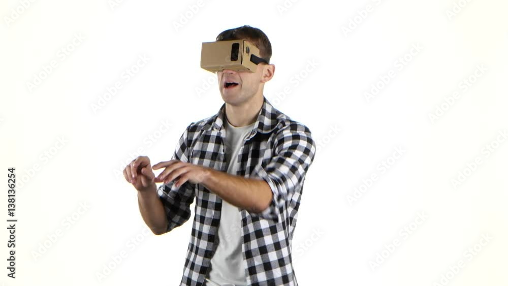 Cardboard of vr glasses. Man surprised by what he saw Cardboard of vr glasses. Man surprised by what he saw