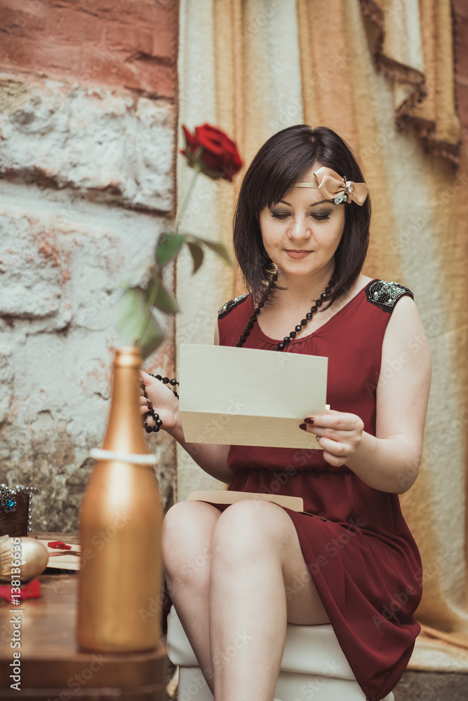 retro girl sitting at a dressing table with a letter in your hands retro girl sitting at a dressing table with a letter in your hands