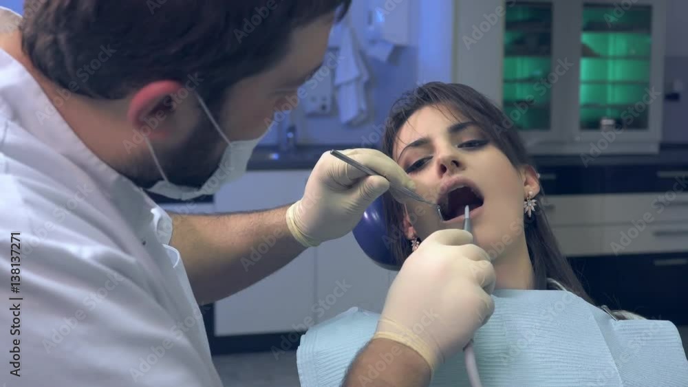 Dentist examines the patient's teeth and clinic diagnoses Dentist examines the patient's teeth and clinic diagnoses
