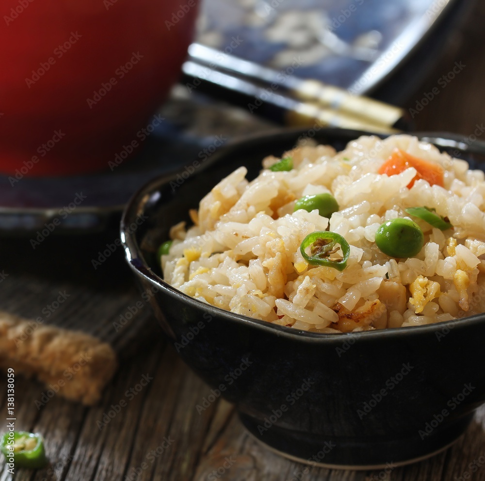 Chinese Fried rice served in s bowl, selective focus Chinese Fried rice served in s bowl, selective focus