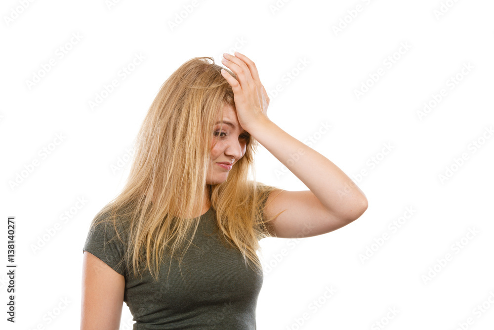 Ashamed embarrassed blonde woman with hand on face Ashamed embarrassed blonde woman with hand on face