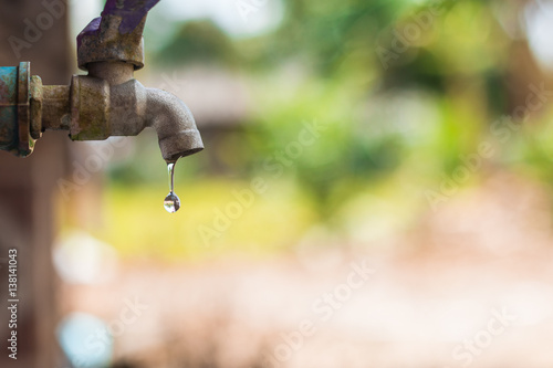 water drop from  tap,Leaking water
