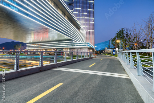 empty asphalt road along modern business buildings in city of China. © fanjianhua