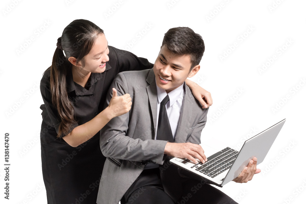 portrait of asian couple in love with laptop. A young mand smiling to his girlfriend that showing thumb up to him. Isolated on white background with copy space portrait of asian couple in love with laptop. A young mand smiling to his girlfriend that showing thumb up to him. Isolated on white background with copy space