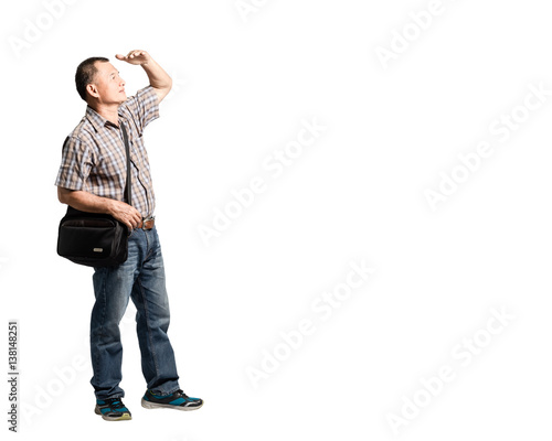 Portrait of a happy mature man raise arm and hand for visor and waiting for something. Isolated full body on white background with copy space