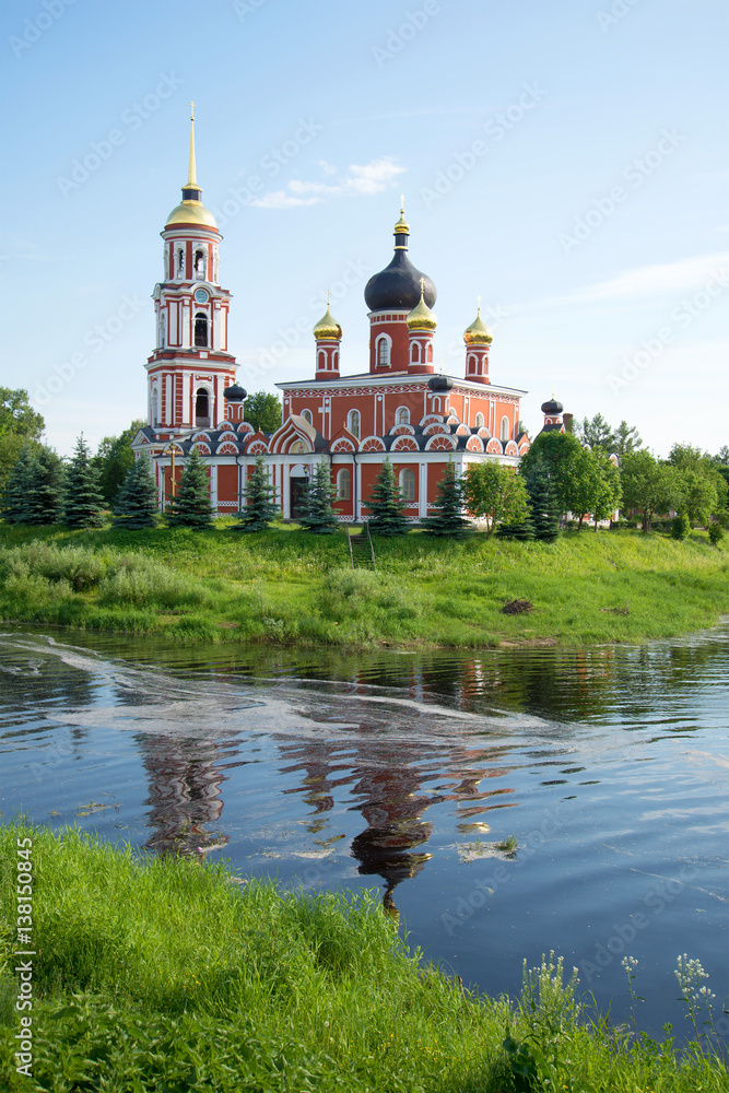 View of Resurrection Cathedral on the river bank Polist in the sunny June afternoon. Staraya Russa, Russia