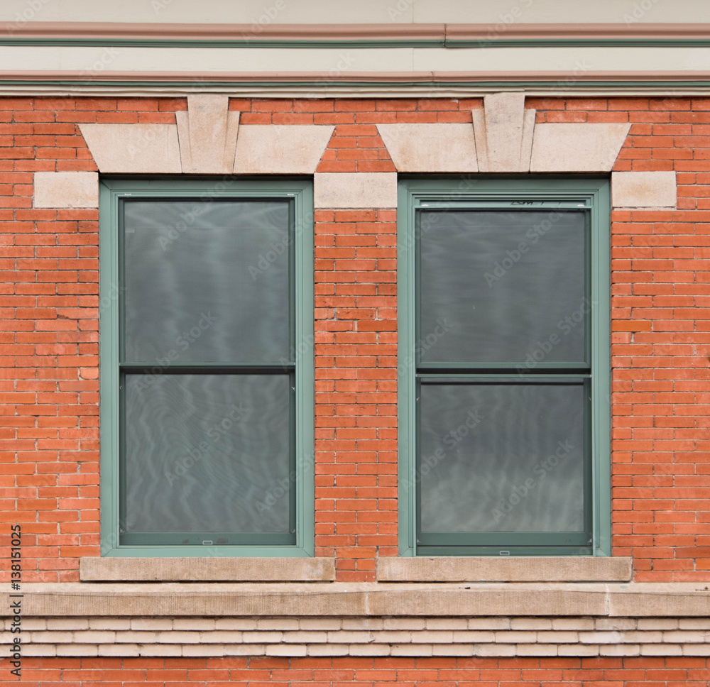 Fototapeta premium Green Windows in Brick Wall with Art Deco Trim