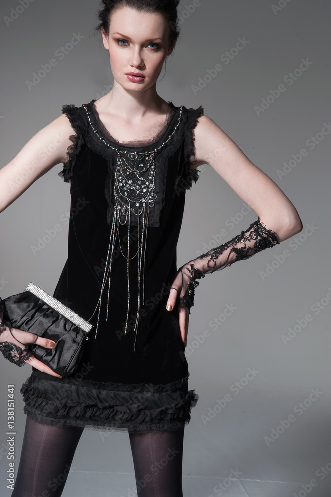 fashion model in modern clothes holding handbag posing fashion model in modern clothes holding handbag posing