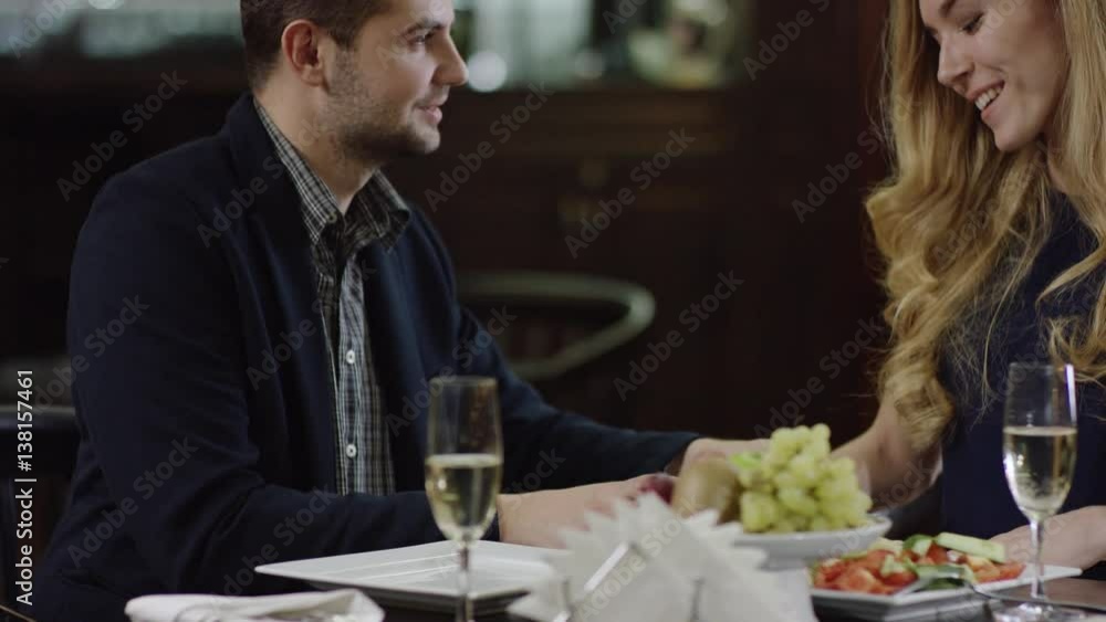 smiling cute lady getting a present to valentines day and kiss man smiling cute lady getting a present to valentines day and kiss man