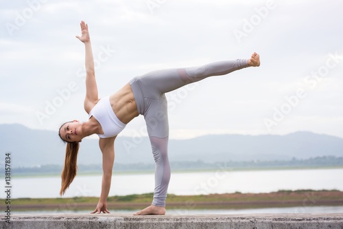 Asia woman doing yoga fitness exercise