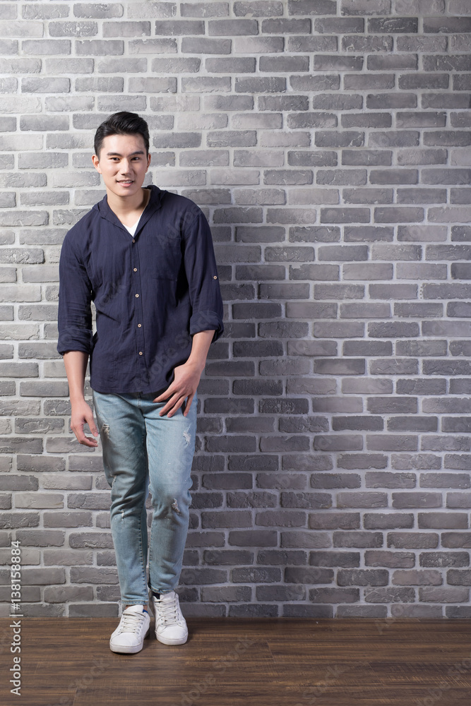 man stand with brick wall man stand with brick wall