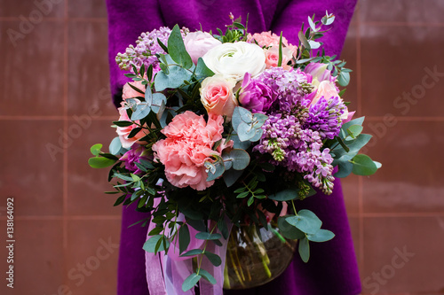 Woman holding beautiful bouquet of flowers photo