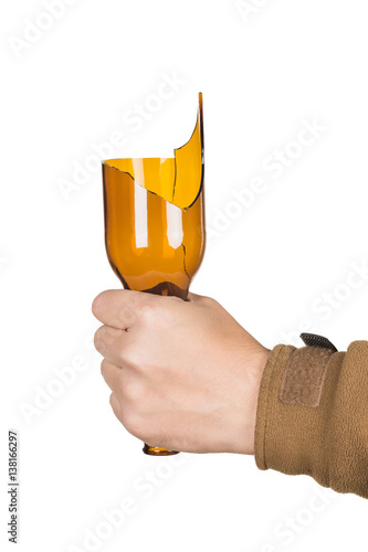 Male hand with broken glass bottle, isolated on white background