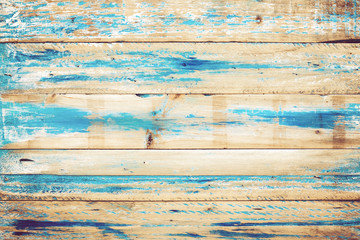 Old wooden background with blue paint. vintage wood texture from beach in summer.
