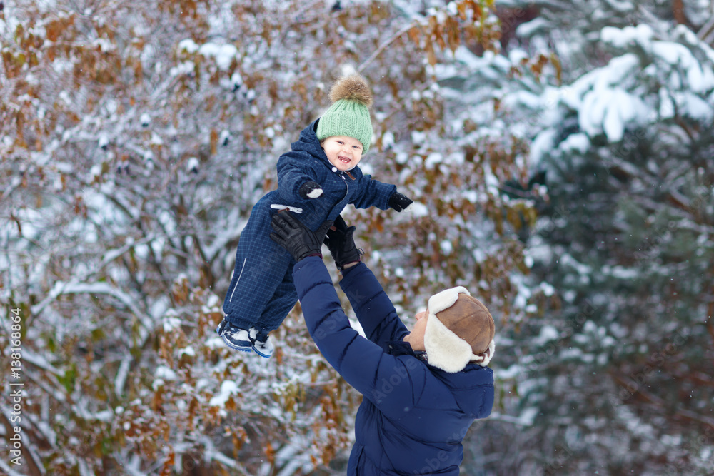 Little boy with father outdoor. Winter. Little boy with father outdoor. Winter.