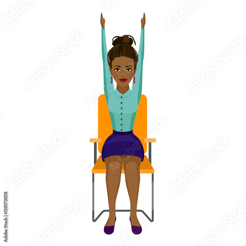 Pretty African American woman in business clothes is doing exercises on the office chair. Business woman in healthy hands up pose.