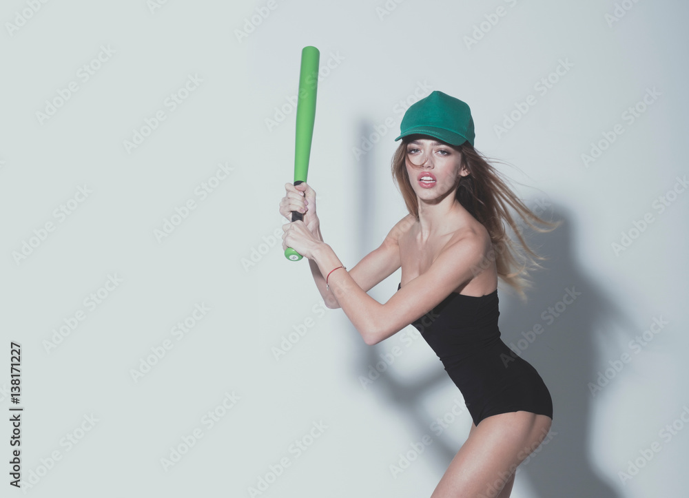 pretty sexy woman with long hair holds green baseball bat pretty sexy woman with long hair holds green baseball bat