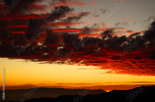 Dramatic fiery sunset over the mountains