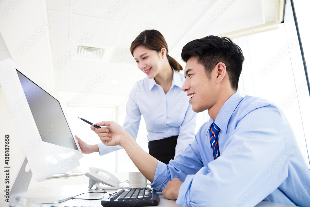 Business people discussing the plan in office Business people discussing the plan in office
