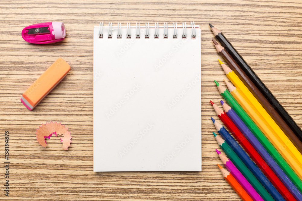 School supplies on wooden background School supplies on wooden background