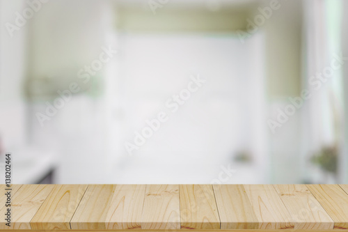 Empty top wood table and blurred bath room background. © bongkarn
