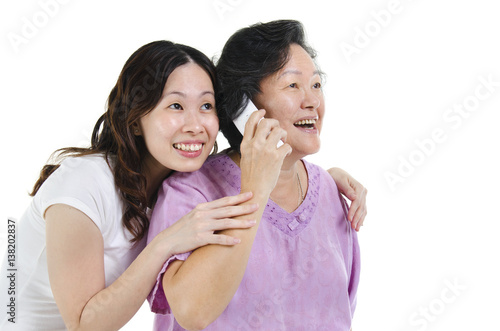 Mother and daughter calling on phone