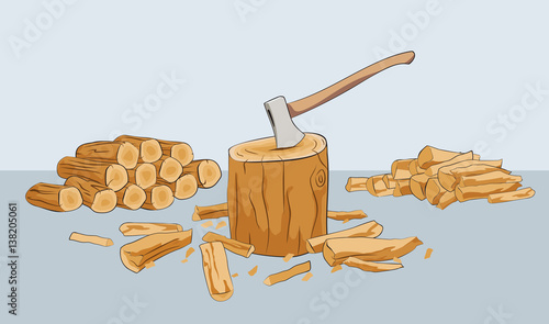 Chopped firewood logs and stump with axe