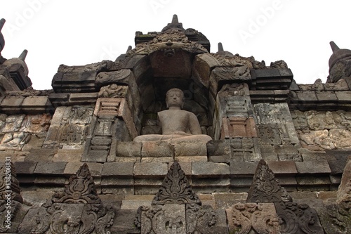 Buddha statue in stupa, Borobudur, near Yogyakarta/Borobudur temple stupas near Yogyakarta, Java, Indonesia/