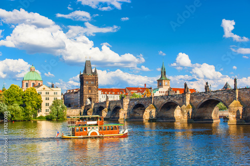 Tableau sur toile Prague, Czech Republic, Charles Bridge across Vltava river on which the ship sai