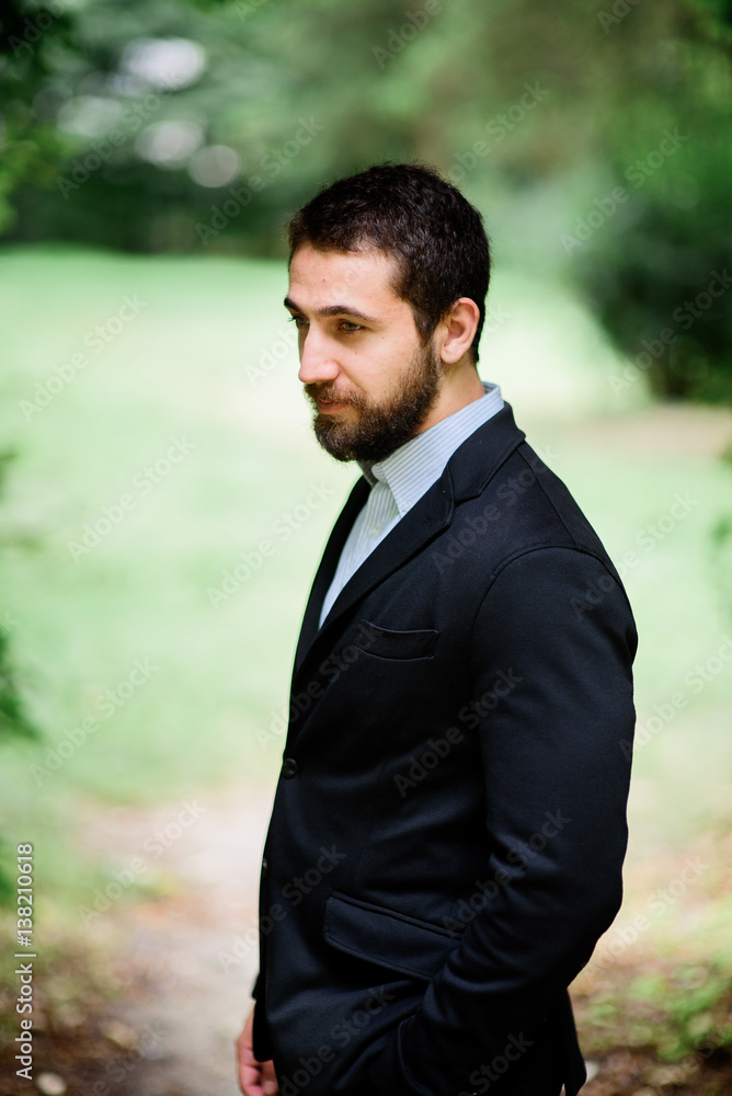 Picture of thoughtful bearded man in black suit Picture of thoughtful bearded man in black suit